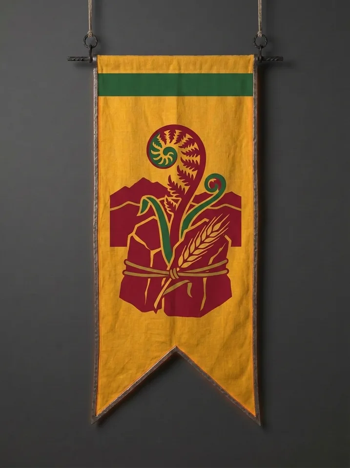 The banner of Brakkenstone: A bracken fern uncurling out of a split block of granite, an ear of barley bound to the stone with a leather thong, a mountain ridge behind.