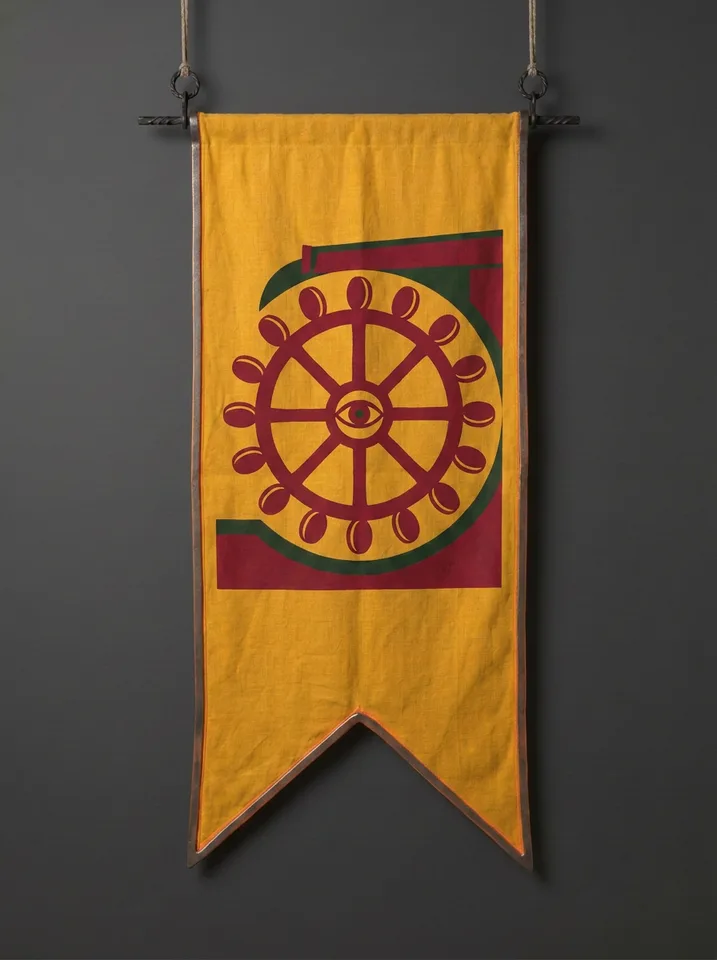 The banner of Wraymoor: A mill-wheel turning in its race with every paddle struck as a coin, a single eye at the wheel's hub.